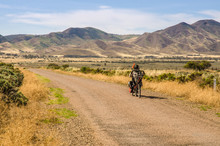 Man Riding Recumbent Bicycle In Remote Area