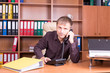 © pbogdanov - man in office talking on phone