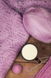 lilac sweater with a cup of milk on a wooden table