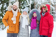 © Syda Productions - group of smiling men and women in winter forest