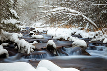 A River With Rocks In Snow, Russian Nature