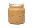 Peanut butter in a mason jar over white background