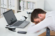 © Andrey Popov - Businessman With Laptop Sleeping At Desk