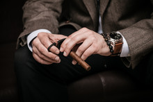 Elegant Man Wearing Suit And White Shirt Cut Cuban Cigar Indoor Shot, Closeup, Selective Focus