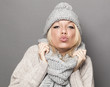 © STUDIO GRAND WEB - sexy winter woman expressing tenderness in pouting and kissing signs