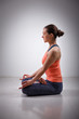Woman meditate in yoga asana Padmasana Lotus pose