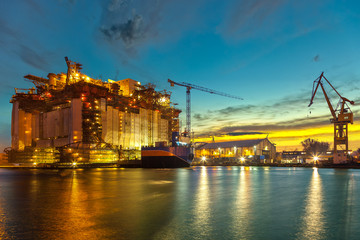 Wall Mural - Oil rig under construction at the yard in the morning.