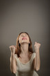 © alexandrum01 - Portrait of young woman winner gesture. Winning success woman happy ecstatic celebrating being a winner.