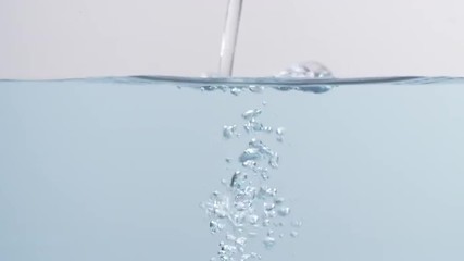 Wall Mural - water pouring in a slow motion