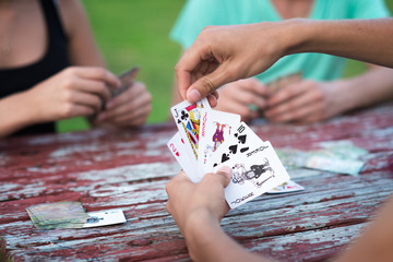 Group of people playing cards