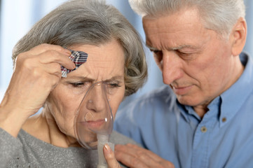 Wall Mural - Elderly  couple making inhalation