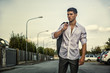 © theartofphoto - Handsome young man in elegant white shirt standing outdoor