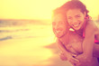 Beach couple in love having fun on honeymoon