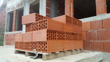 Several Red Perforated Brick On Pallet