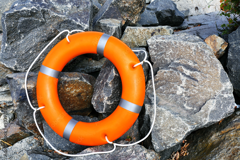 A life buoy on stones background