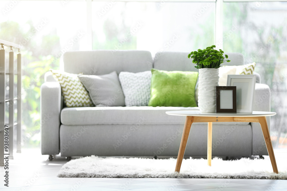 Beautiful green chrysanthemums in vase on table in room