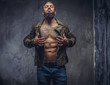 © Fxquadro - Fashion tattooed man with beard.