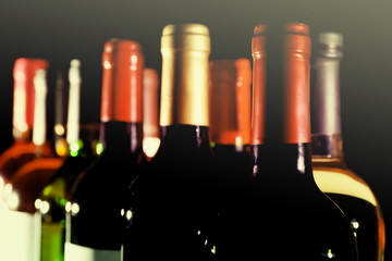 Poster - wine bottles in two rows on black background