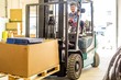 © Nejron Photo - Man driving forklift truck on a warehouse