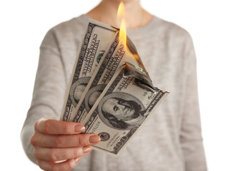 Wall Mural - Woman burning dollar banknotes isolated on white