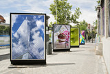 Fototapeta  - billboards with photographs at city street