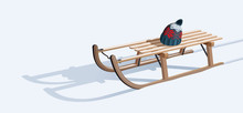 Wooden Sled And Hat On Snow