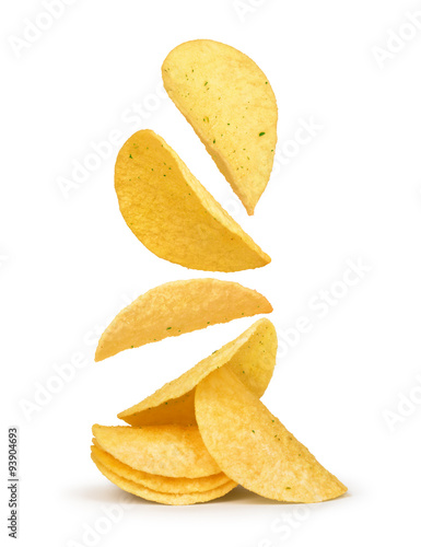 Fotografía potato chips falling in the air on an isolated white background