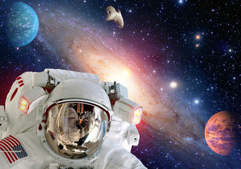 Wall Mural - Astronaut spaceman helmet outer space suit solar system planet. Elements of this image furnished by NASA.