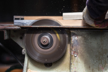 Old carpenter working with wood