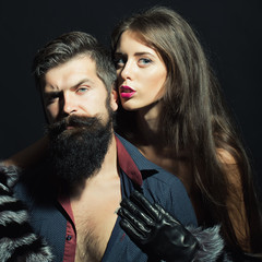 Man with beard and girl in gloves