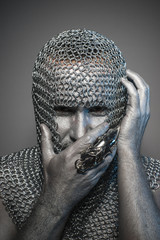 Wall Mural - man in chain mail and leather painted silver, medieval warrior