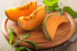 cantaloupe melon sliced on wooden background