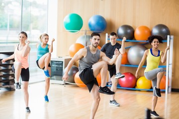 Wall Mural - Fitness class exercising in the studio