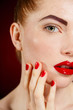 © GTeam - Studio portrait of a redhead female model.