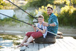 © mrcats - Man and boy fishing on the lake
