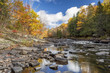 Autumn Colors Lining a Rock-strewn River