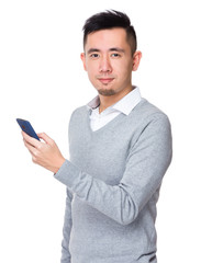 Canvas Print - Young businessman use of the mobile phone