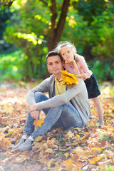 Wall Mural - Happy family having fun on beautiful autumn day