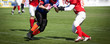 © Melinda Nagy - american football game with out of focus players in the backgrou