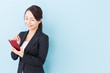 © taka - portrait of asian businesswoman on blue background