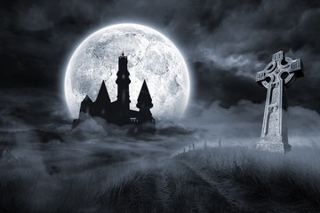 castle and grave under full moon