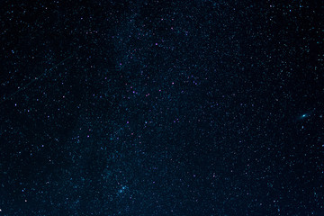 Wall Mural - starry night dark sky with tracks from shooting stars