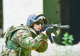 Wall Mural - Military soldier with assault rifle patrolling