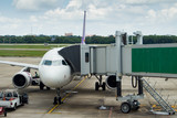 Fototapeta  - jetway to a plane in airport, transport