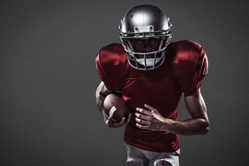 Wall Mural - Composite image of american football player running with ball