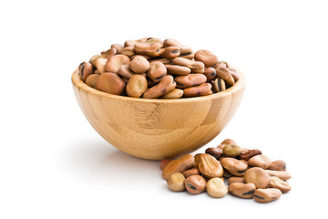 dried broad beans in wooden bowl