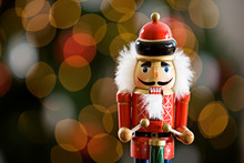 Christmas: Traditional Wooden Nutcracker With Tree Behind