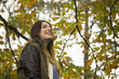 © HD92 - Profile shot of young casual hipster girl, smilling. Low angle v