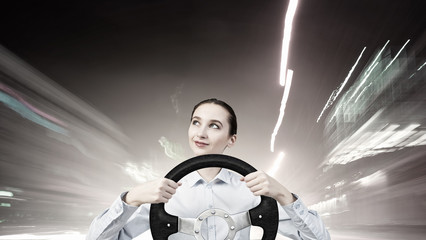 Woman with steering wheel