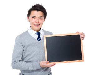 Wall Mural - Young businessman show with chalkboard